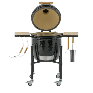 Monolith ONE 55 kamado grill with open lid showing ceramic interior and stainless steel grill grate, ideal for outdoor barbecuing.