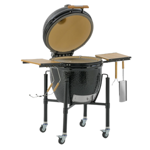 Side view of Monolith ONE.66 Ceramic Grill with open dome lid, dual wooden side tables, and utensil holders for efficient BBQ setup.