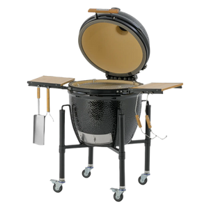 Monolith ONE.66 Ceramic Grill with open lid and visible grill grate, mounted on a black wheeled frame with foldable wooden shelves.