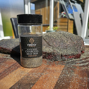 BBQ seasoning jar with smoked beef on wooden table