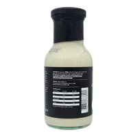 Close-up of Alabama White BBQ Sauce bottle with black cap