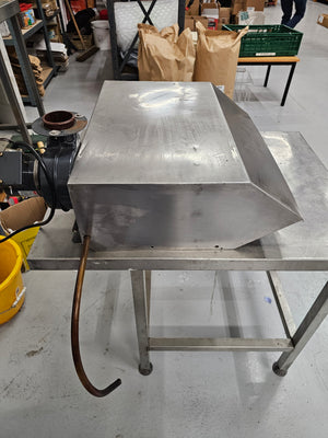 Side profile of Cookshack Smokehood 100 Series with copper tubing and motor assembly, used in outdoor grill ventilation systems.