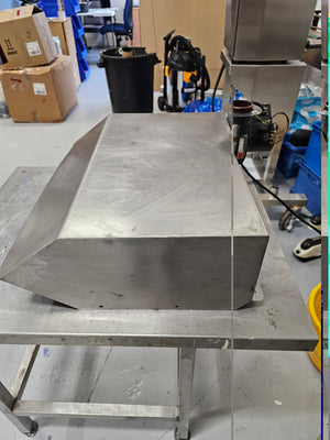 Side angle of Cookshack Smokehood 100 Series highlighting angled hood design and attached ventilation components for outdoor grilling.