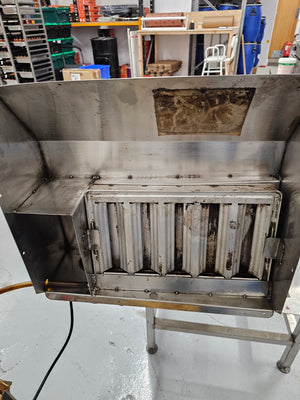 Cookshack Smokehood 100 Series with internal baffle filter installed, designed for efficient smoke capture in outdoor kitchen appliances.