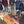 Group of people at outdoor BBQ event with food and drinks