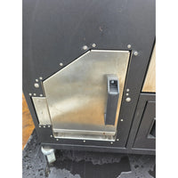 Bottom of smoker showing black textured surface