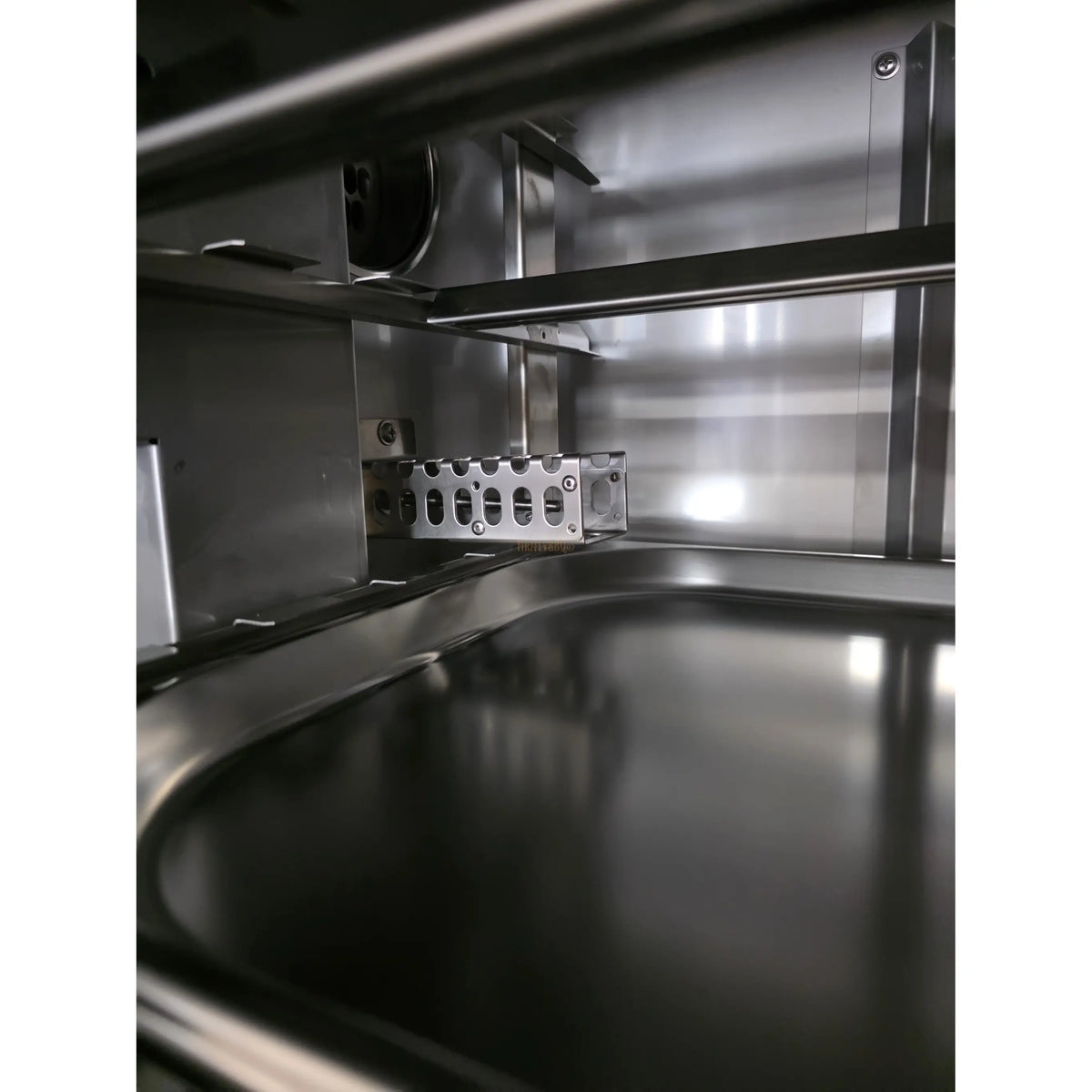 Stainless steel interior of a commercial smoker
