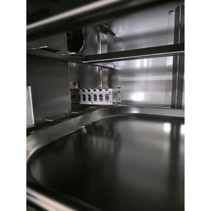 Detail of Borniak Commercial Smoker's smoke generator area with stainless steel tray for wood chips, enhancing BBQ flavor.