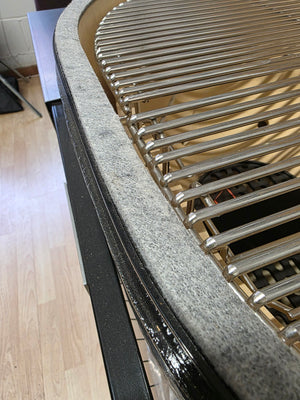 Detail of Primo Kamado Charcoal Grill gasket seal and stainless steel cooking grates for heat retention and durability.