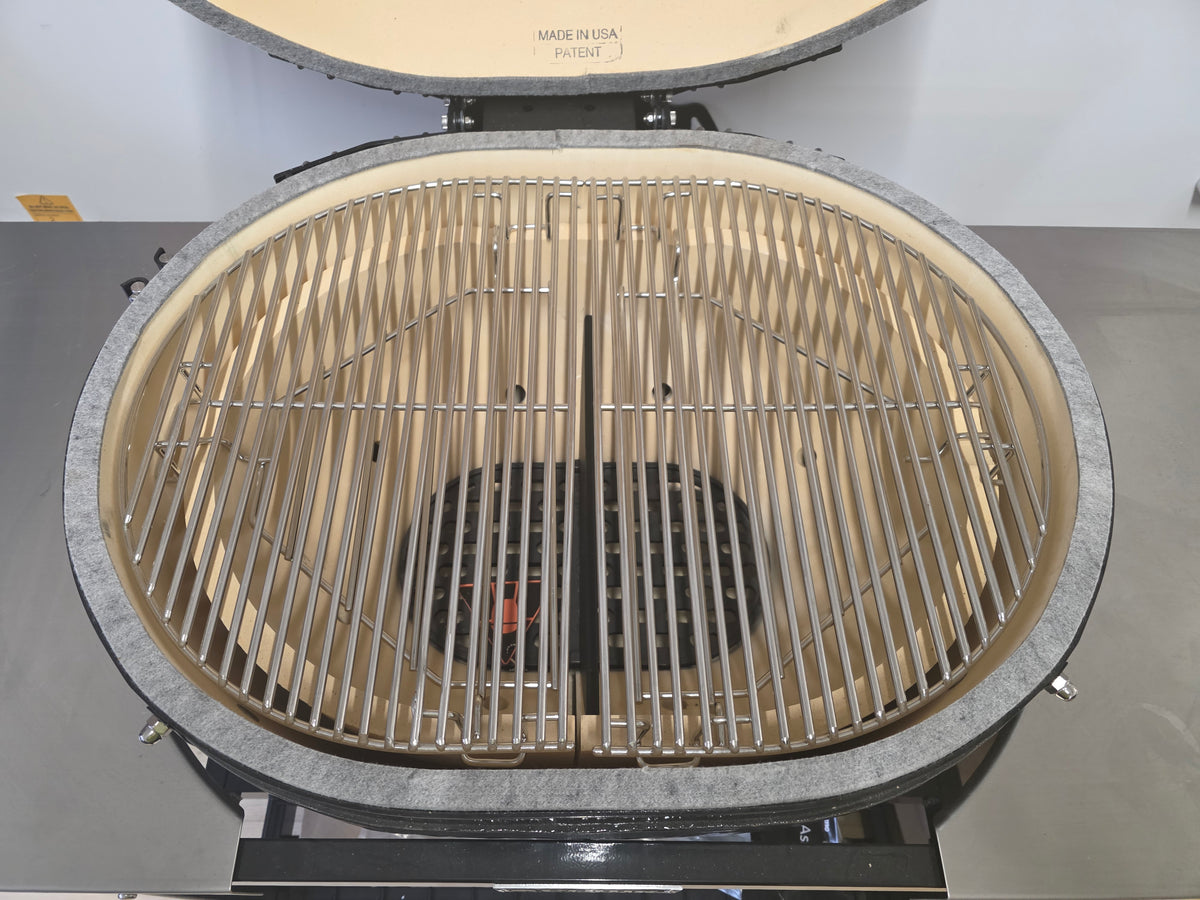 Top-down view of Primo Kamado Charcoal Grill interior with dual-zone stainless steel grates and ceramic firebox.