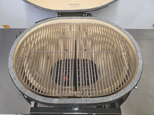 Top-down view of Primo Kamado Charcoal Grill interior with dual-zone stainless steel grates and ceramic firebox.