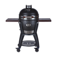 Black kamado grill with wooden side shelves and mobility wheels