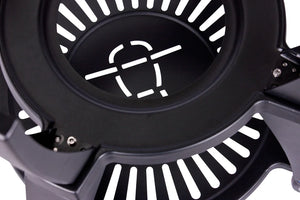 Close-up of the circular grill surface with slotted design and branding