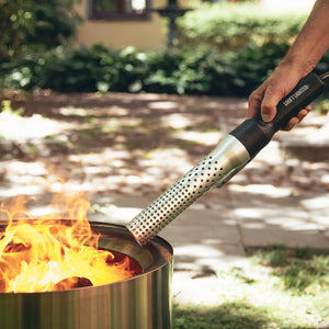 Looftlighter Electric Grill & Fire Starter lighting a fire pit outdoors, perfect for backyard gatherings and safe fire starting.