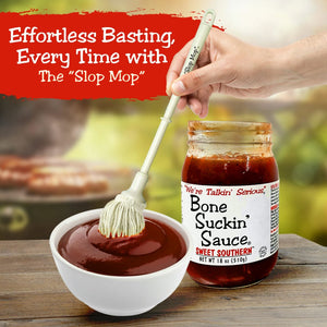 BBQ Basting Mop Tool - Elevate Your Grilling using Bone Suckin' The Slop Mop, shown dipping into Bone Suckin' Sauce for effortless basting.