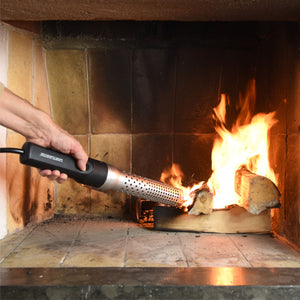 Looftlighter Electric Grill & Fire Starter used to ignite logs in an indoor fireplace, offering fast, chemical-free fire starting indoors.