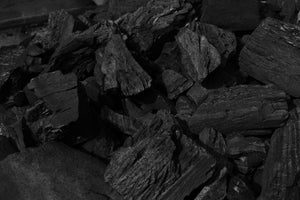 Close-up of Big K Dura lumpwood charcoal pieces, sustainably sourced hardwood for restaurant-grade BBQ performance and steady heat output.