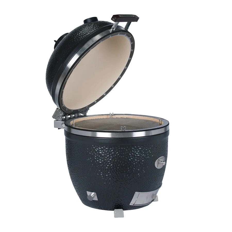 Open Monolith Kamado grill with interior grilling surface and lid
