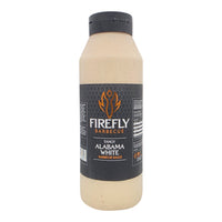 Creamy Alabama White BBQ Sauce being poured