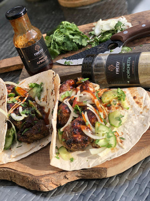 Barbecue sauce bottle with grilled meat and vegetables