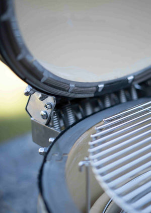 Close-up of Monolith Avantgarde Kamado grill interior with stainless steel fittings and heat-resistant gasket