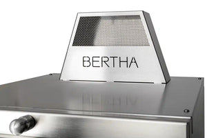 Top vent detail of Bertha Charcoal Oven with Stand on Casters, featuring mesh chimney for smoke control and airflow regulation.