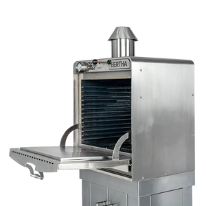 Side-open view of Bertha Professional X Charcoal Oven for Compact Cooking, highlighting spacious interior and pull-out tray.