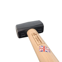 Close-up of Kindling Cracker sledge hammer with forged steel head and wooden handle