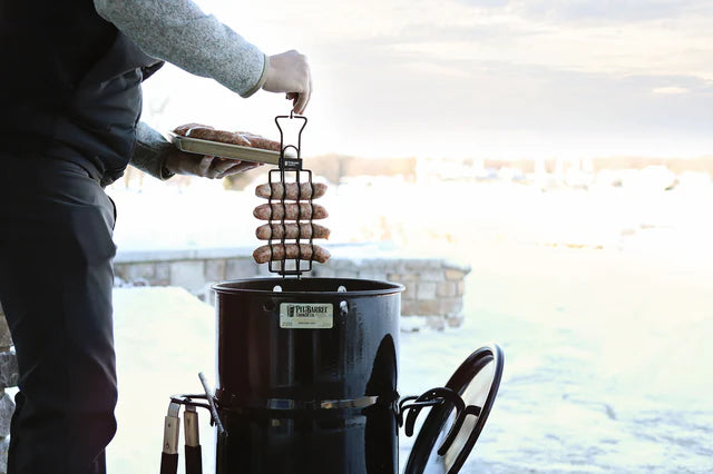 Griller using Pit Barrel Sausage, Hot Dog & Brat Hanger - FireFly Barbecue to smoke sausages in a Pit Barrel Cooker during winter.