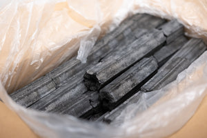 Unboxed Sumi Bincho Charcoal (10kg Box) showing dense, cylindrical briquettes ideal for long-lasting BBQ heat and clean grilling.
