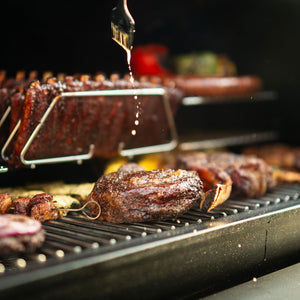 Grill loaded with meat and GMG RACKT Modules in use, showing efficient use of space and even cooking on GMG Trek Cart - FireFly Barbecue.