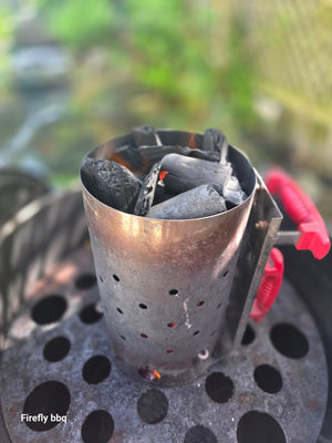 BBQ chimney starter with charcoal