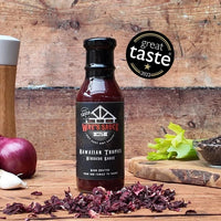 Hawaiian Tropics Hibiscus Sauce on rustic wooden background
