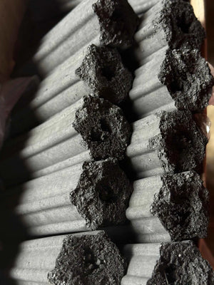 Charcoal briquettes stacked for BBQ grilling