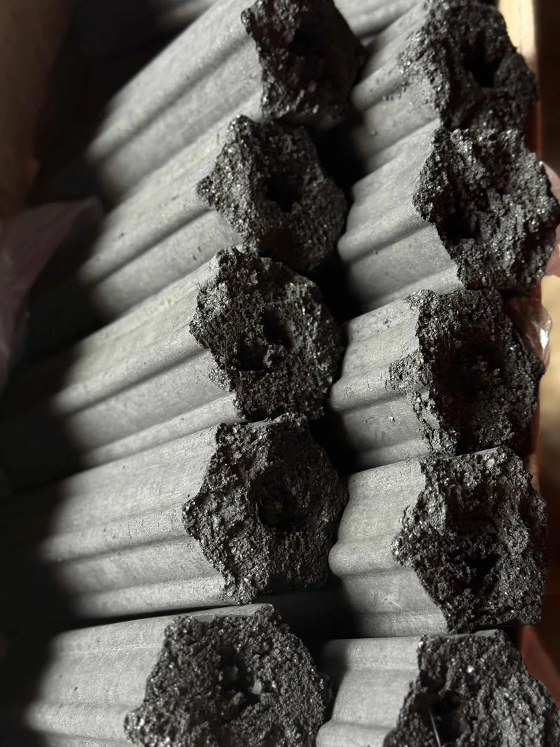 Charcoal briquettes stacked for BBQ grilling