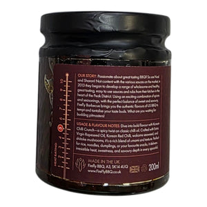 Side label of Korean Chilli Crunch hot sauce jar with usage tips, flavor notes, and brand story from Firefly Barbecue.