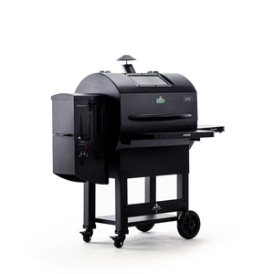 Angled side view of Green Mountain Grills LEDGE PRIME 2.0 Pellet Grill showing hopper, chimney, and side shelf for outdoor BBQ convenience.