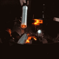 Electric firelighter igniting charcoal in a grill