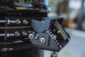 Close-up of Monolith ONE grill hinge and locking mechanism