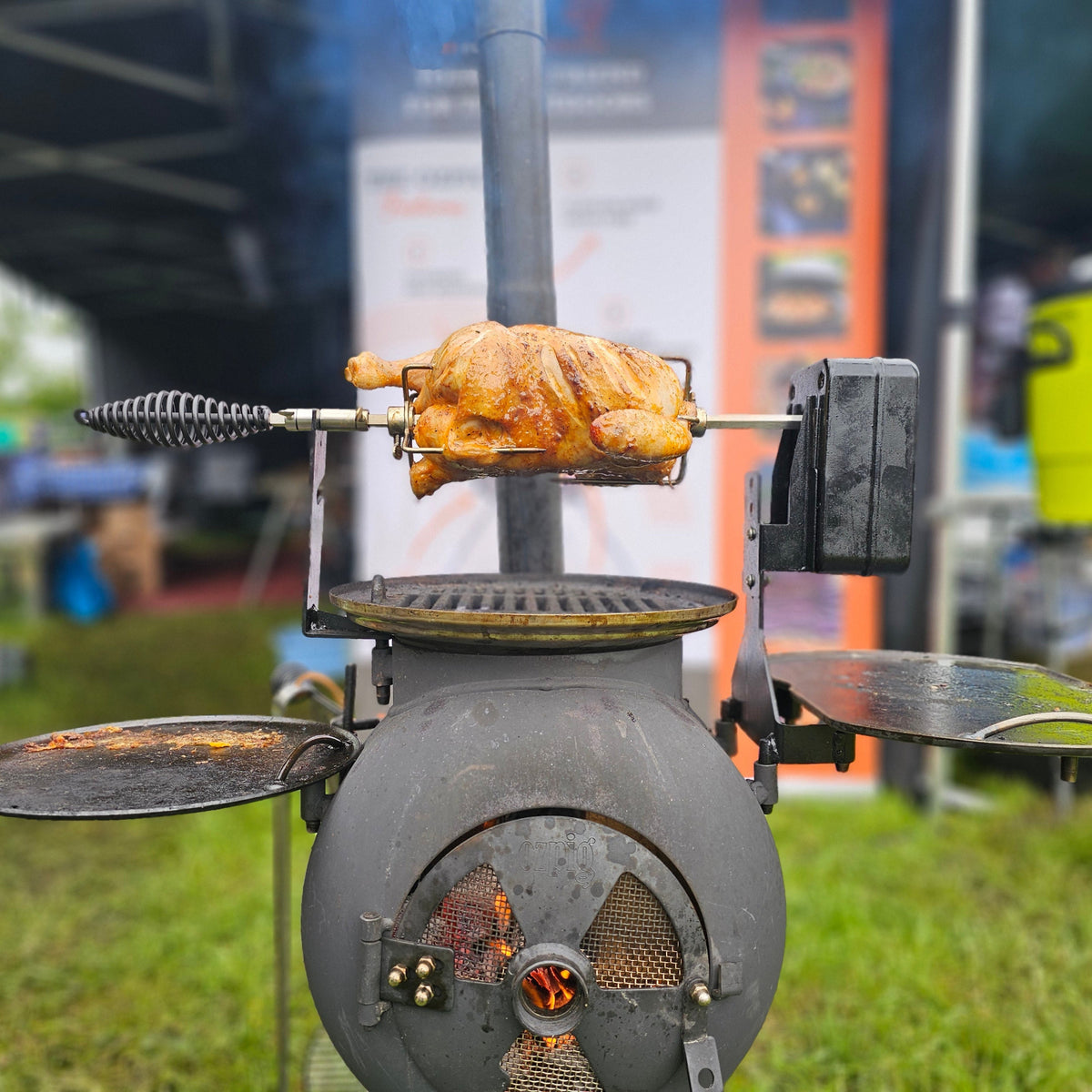 Kamado grill with cooked meat and onions
