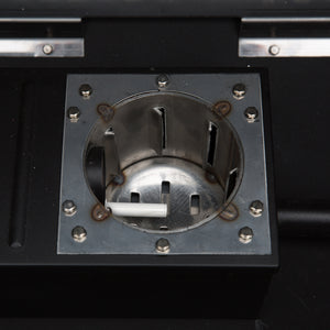 Close-up of Green Mountain Grills PEAK PRIME 2.0 Pellet Grill firebox, emphasizing stainless steel burn pot for efficient heat distribution.