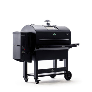 Angled side view of Green Mountain Grills PEAK PRIME 2.0 Pellet Grill featuring digital control panel and chimney for smoke circulation.