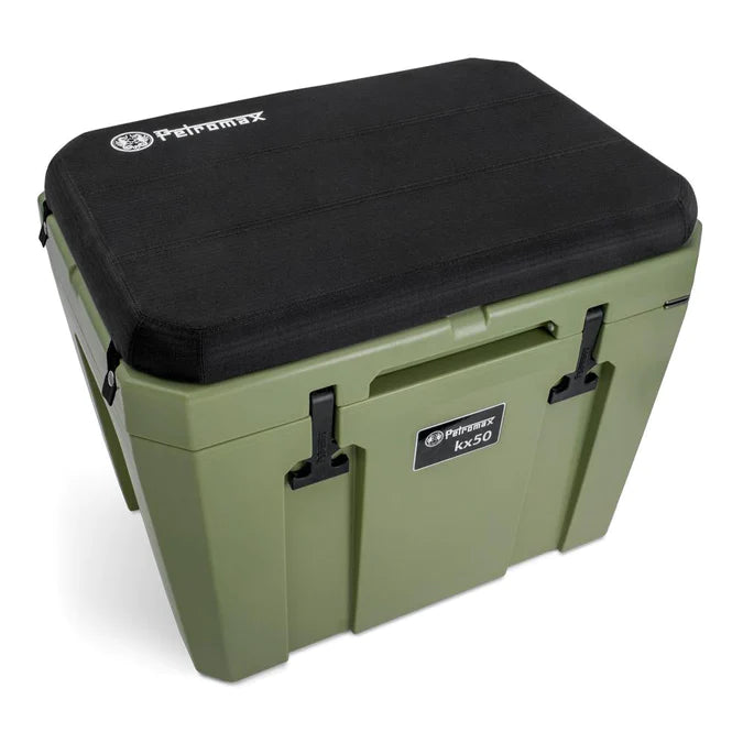Petromax cooler cushion on green cooler outdoors