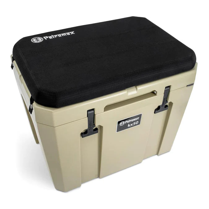 Petromax insulated cooler with black seat cushion, outdoor use