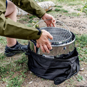 Petromax Atago being packed into a carry bag, showcasing its portability and convenience for camping and outdoor adventures.