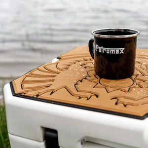Close-up of Petromax Adhesive Pad for 50L Cool Box - Dragon with mug on top, highlighting waterproof surface for outdoor dining.