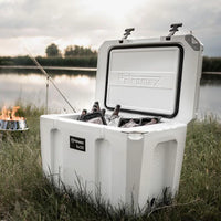 Petromax 50L Cool Box in outdoor setting with ice and fishing gear
