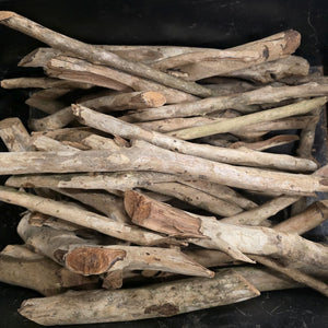 Collection of weathered wooden sticks for outdoor use