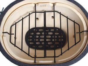 Primo grill interior with ceramic heat deflector and grilling grate