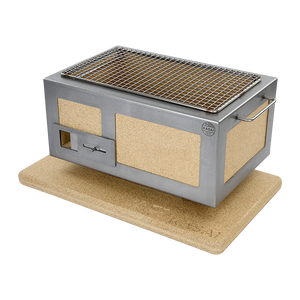 Angled view of the Kasai Konro BBQ Grill with Steel Frame V2 on a cork mat, designed for safe and efficient outdoor grilling experiences.